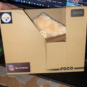 Never been worn steelers pink fluffy slippers. Bought and did not want.